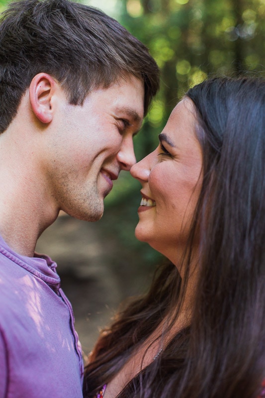 Brandon and Shelby linger over each other for a kiss. Photo by Arkansas Wedding Collection.