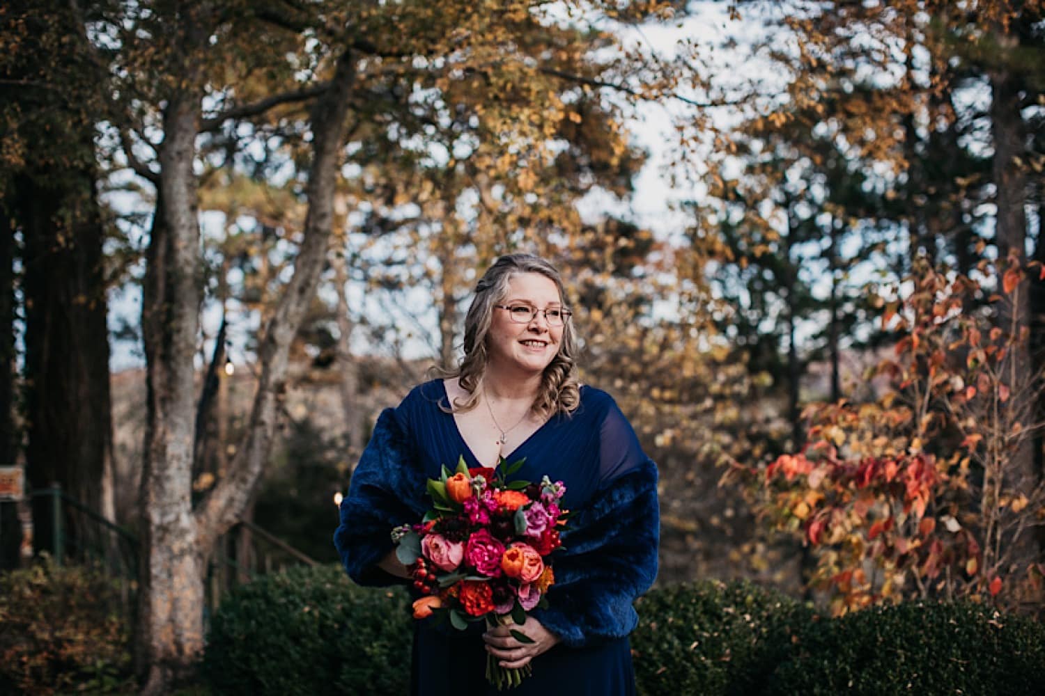 Bride standing outside in the court yard for her Crescent Hotel wedding