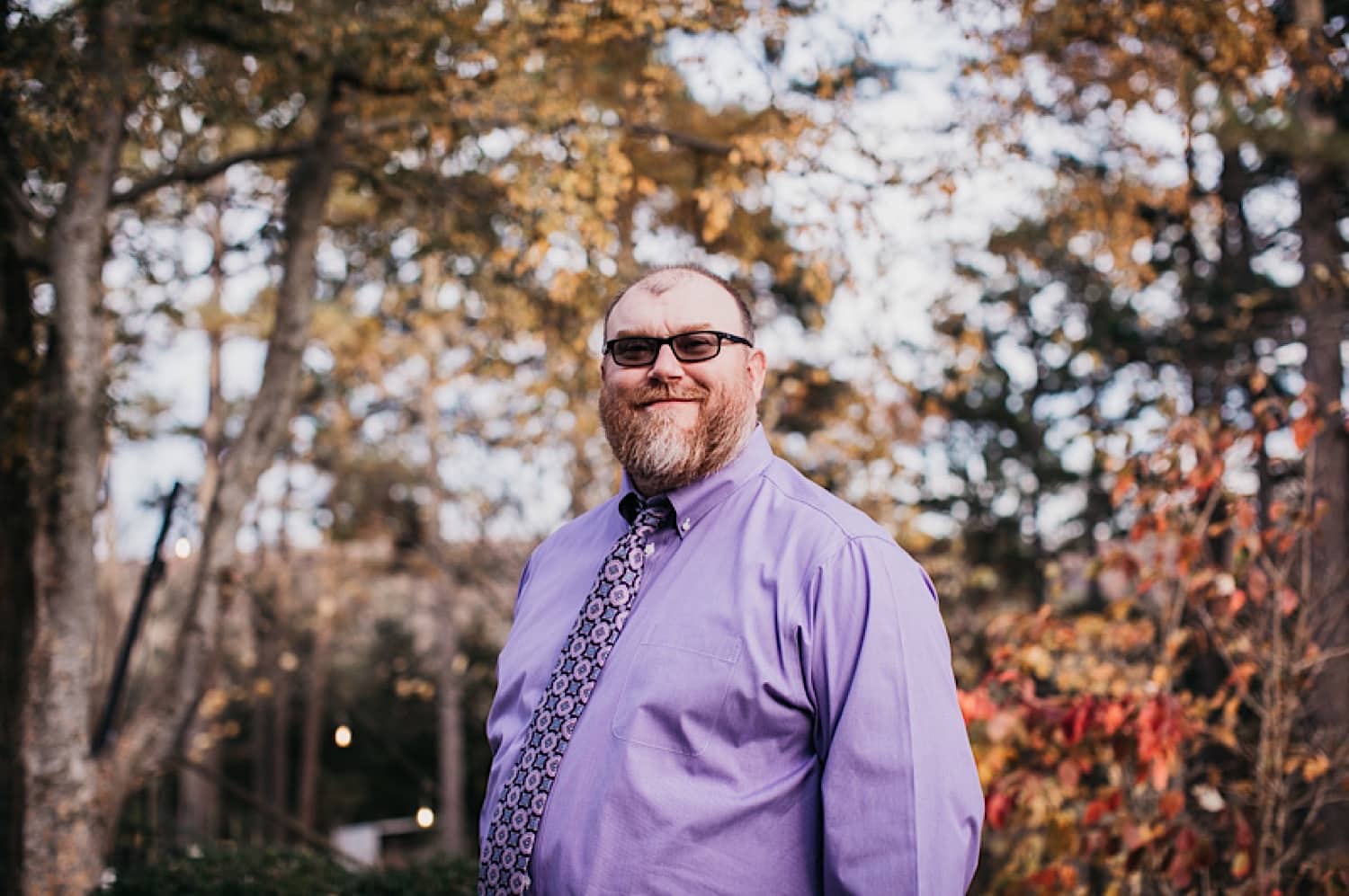 Groom standing outside in the court yard for his Crescent Hotel wedding