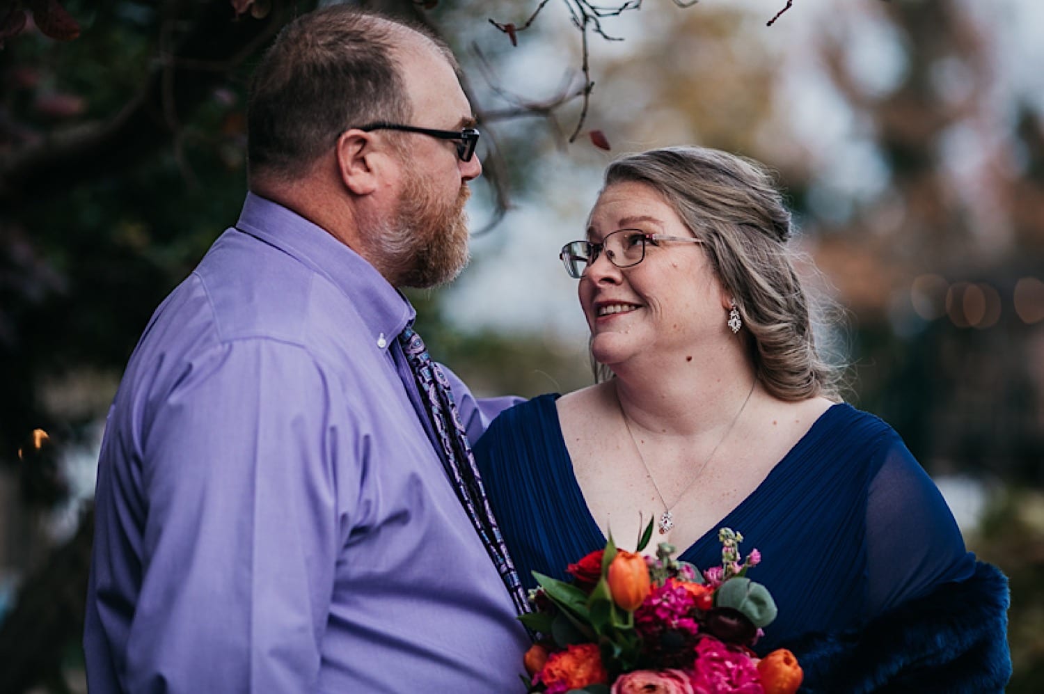 Bride and groom smiling at each other for bridal portraits