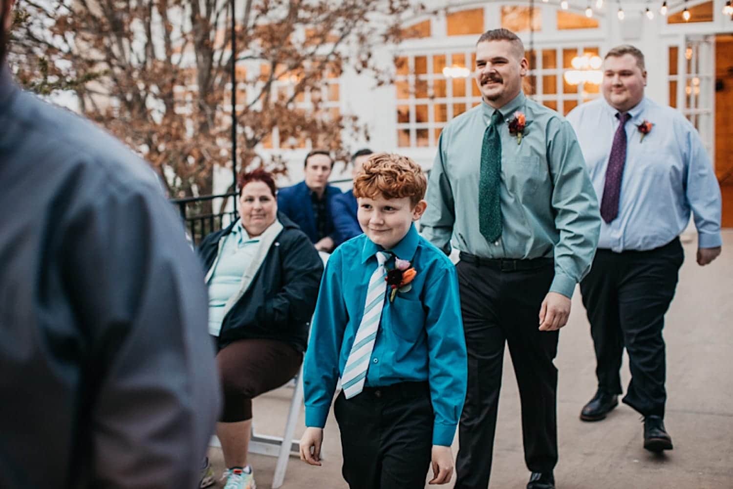 Groomsmen walking down the aisle at Crescent Hotel wedding East Lawn