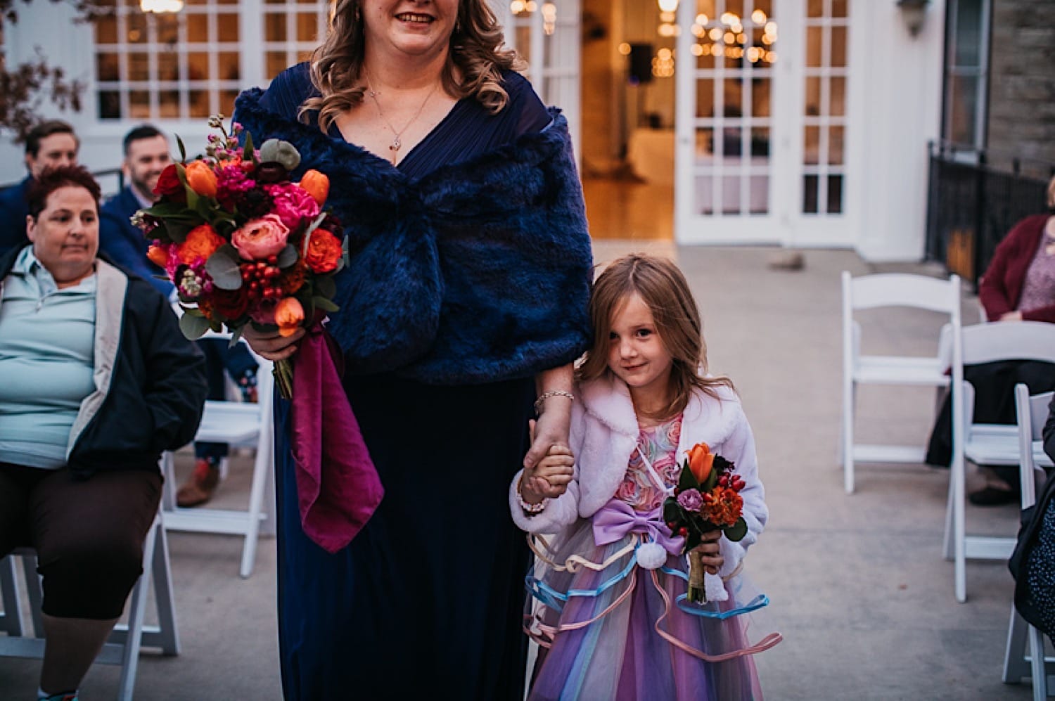 Bride and daughter walking down aisle together at Crescent Hotel