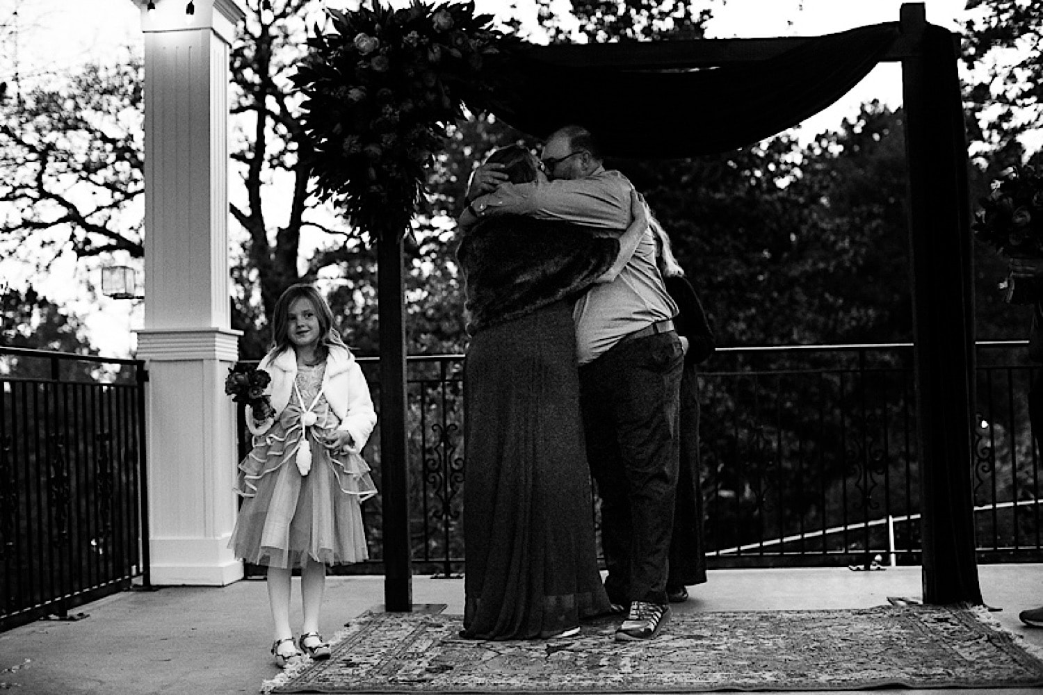 Bride and groom first kiss together at wedding ceremony