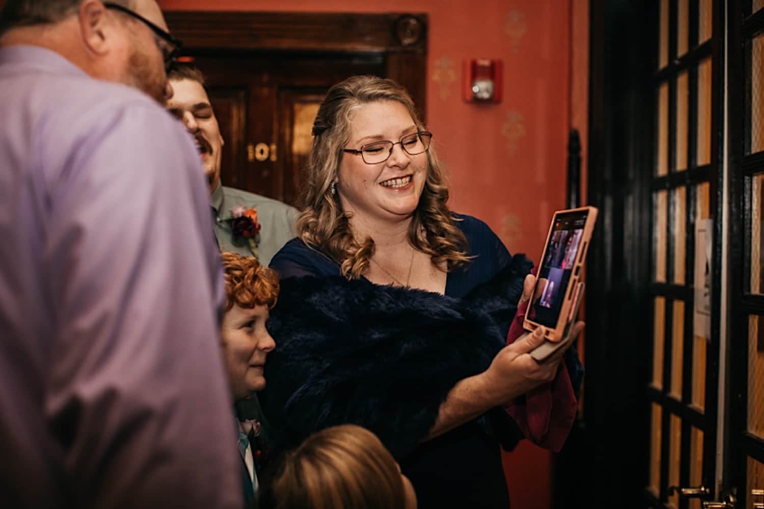 Bride and Groom FaceTiming guests who couldn’t attend Crescent Hotel wedding