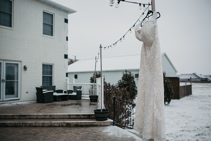 wedding dress wedding details box in the snow