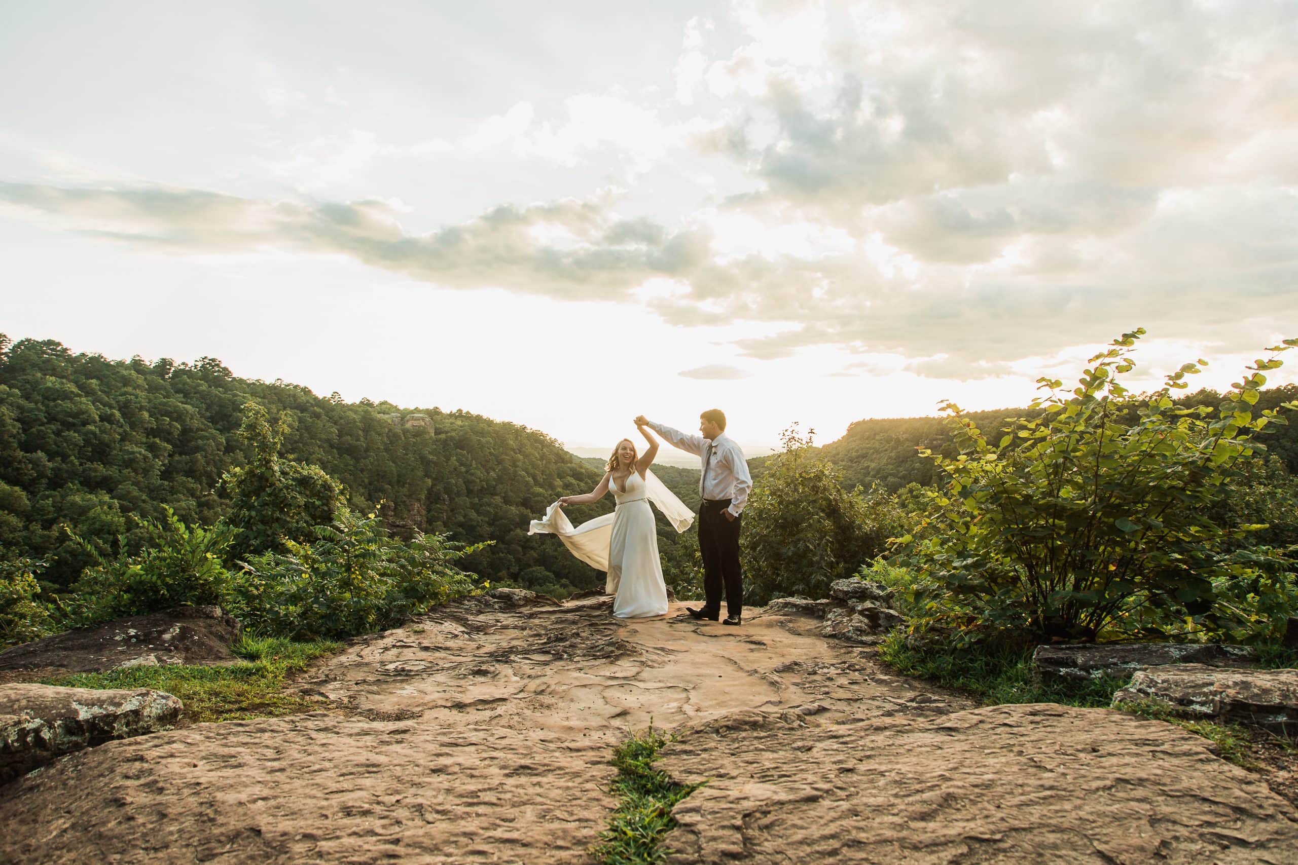 bride and groom dancing at the overlook for their elopement at Petit Jean State Park