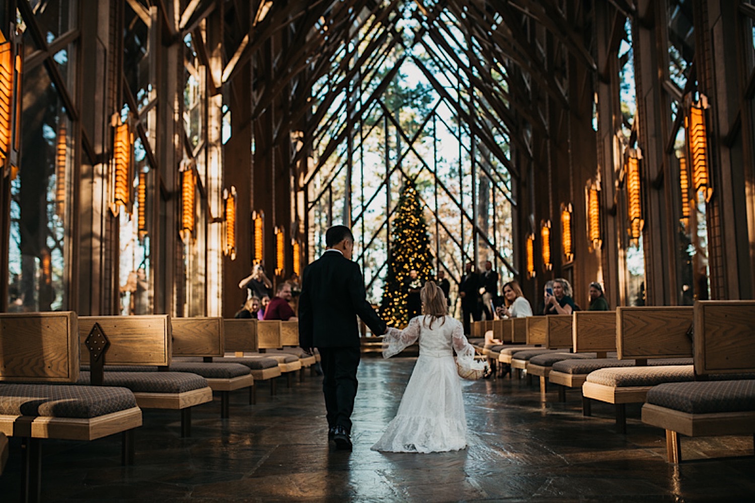 flower-girl-and-ring-bearer-walking-down-aisle-at-Anthony-Chapel