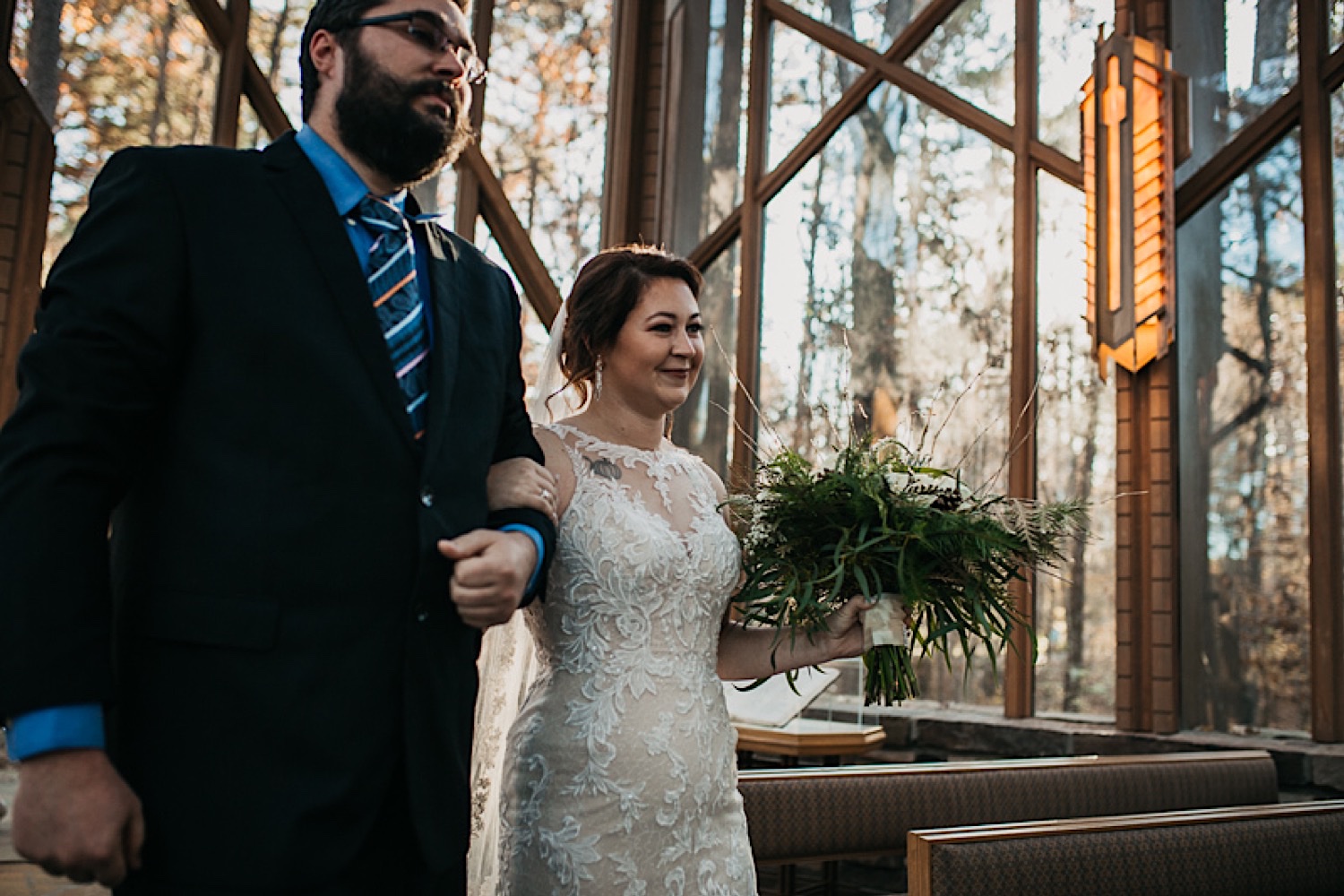 Emily-bride-walking-down-aisle-with-brother-at-Garvan-Woodland-Gardens-Anthony-Chapel
