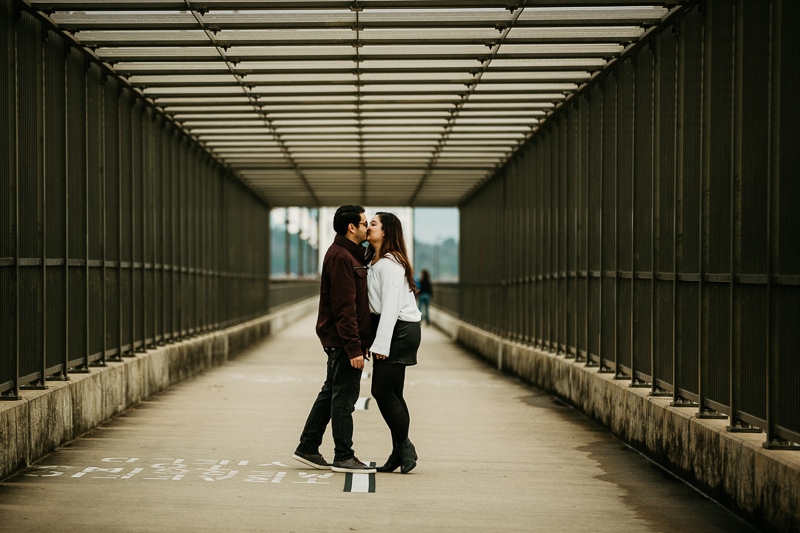 Couple kissing on the Big Dam Bridge in Maumelle Arkansas