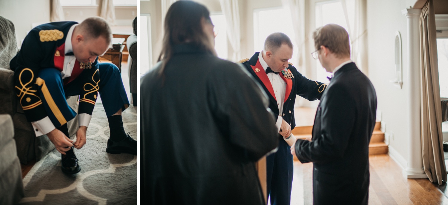 groom-grabbing-offier-blue-mess-jacket-and-putting-on-shoes