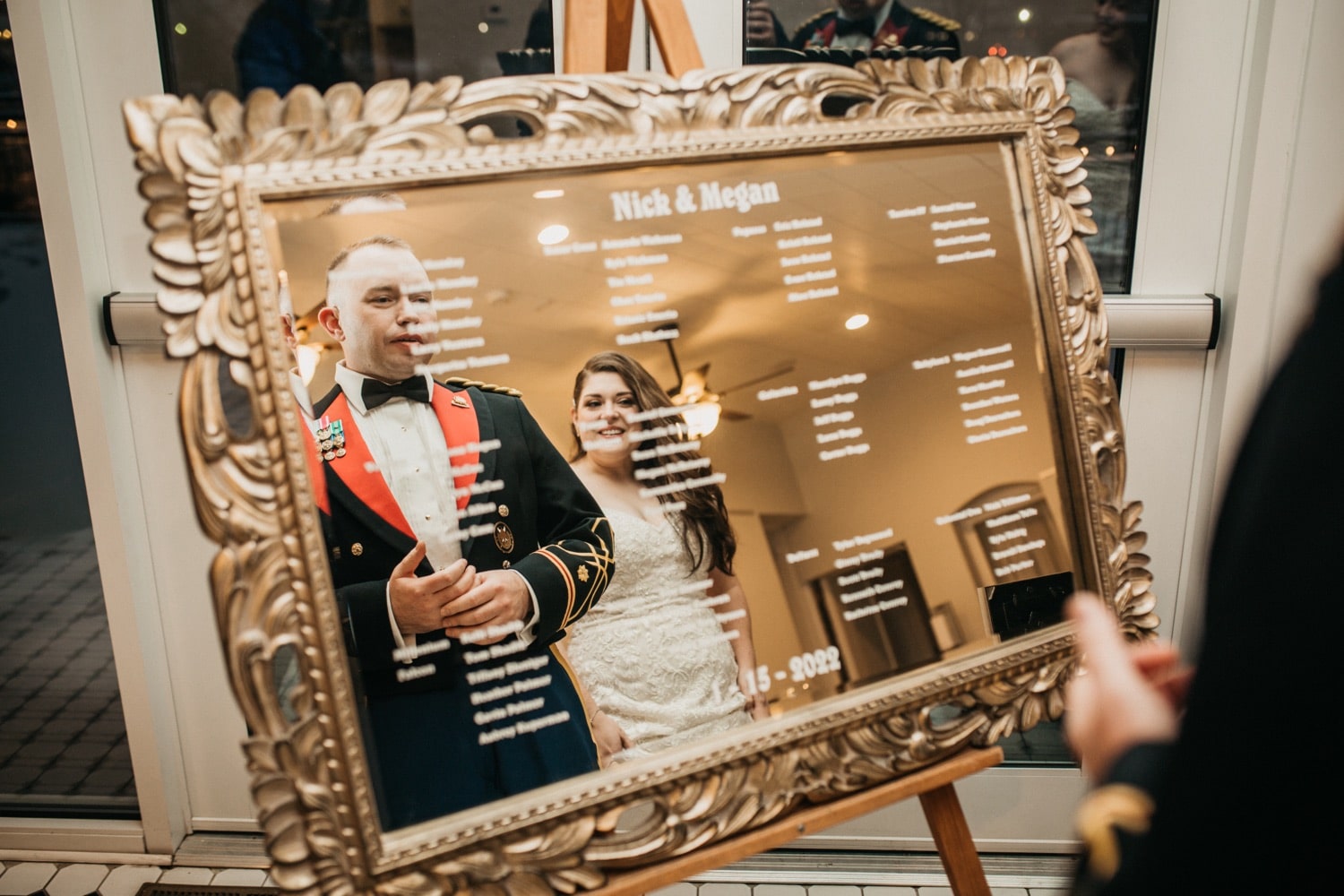 bride-and-groom-standing-in-front-of-mirror