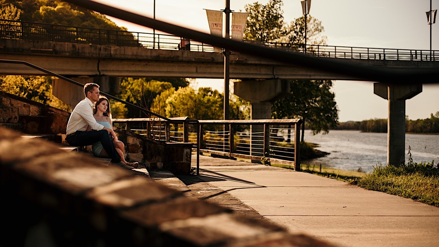 couple-sitting-on-steps-outside-for-engagement-session